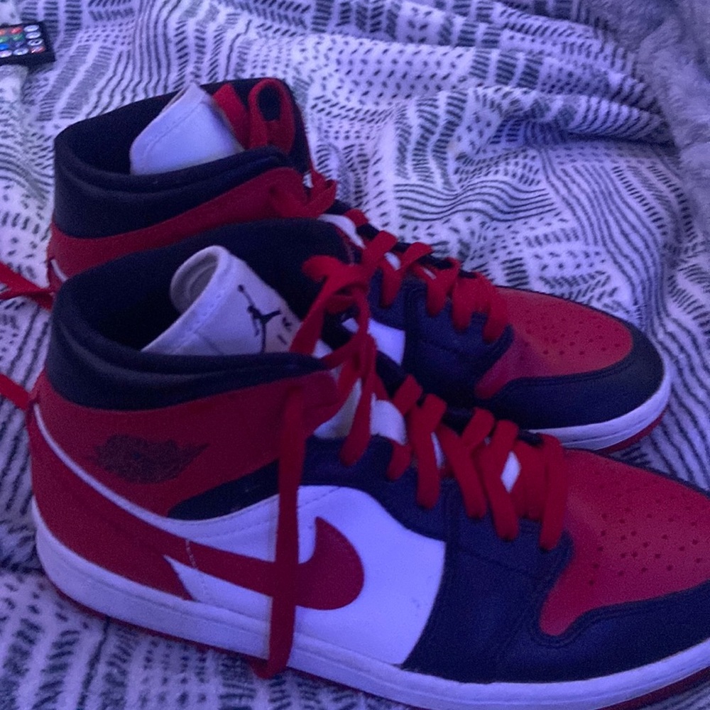 red,black, and white  jordan’s